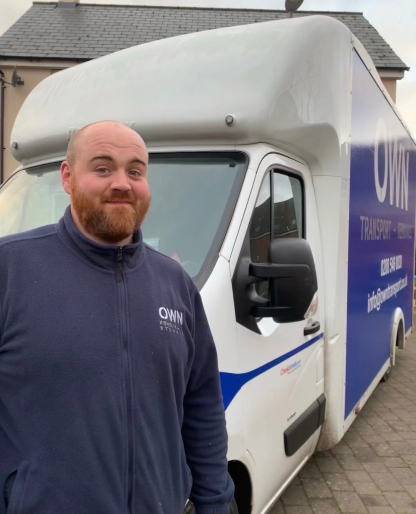 OWN Transport team member with branded event logistics vehicle